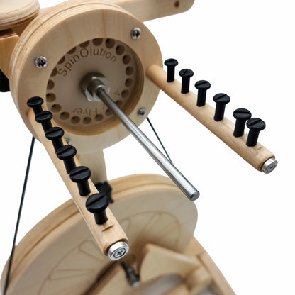 SpinOlution flyer arm closeup attached to a wheel showing hook pegs along length