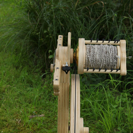 SpinOlution Monarch flyer head with bobbin mounted on the wheel