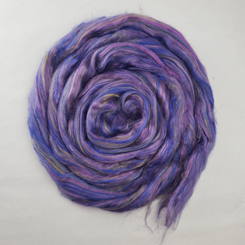 Twilight Garden summer silk blend coiled flat, showing the violet, blue and pink color runs