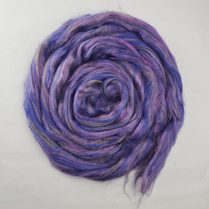 Twilight Garden summer silk blend coiled flat, showing the violet, blue and pink color runs