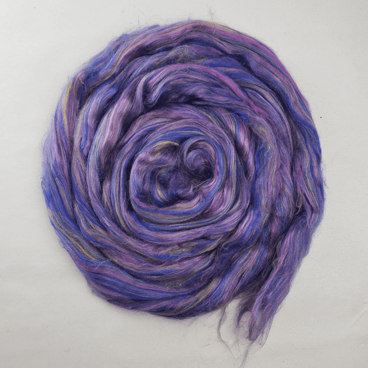 Twilight Garden summer silk blend coiled flat, showing the violet, blue and pink color runs