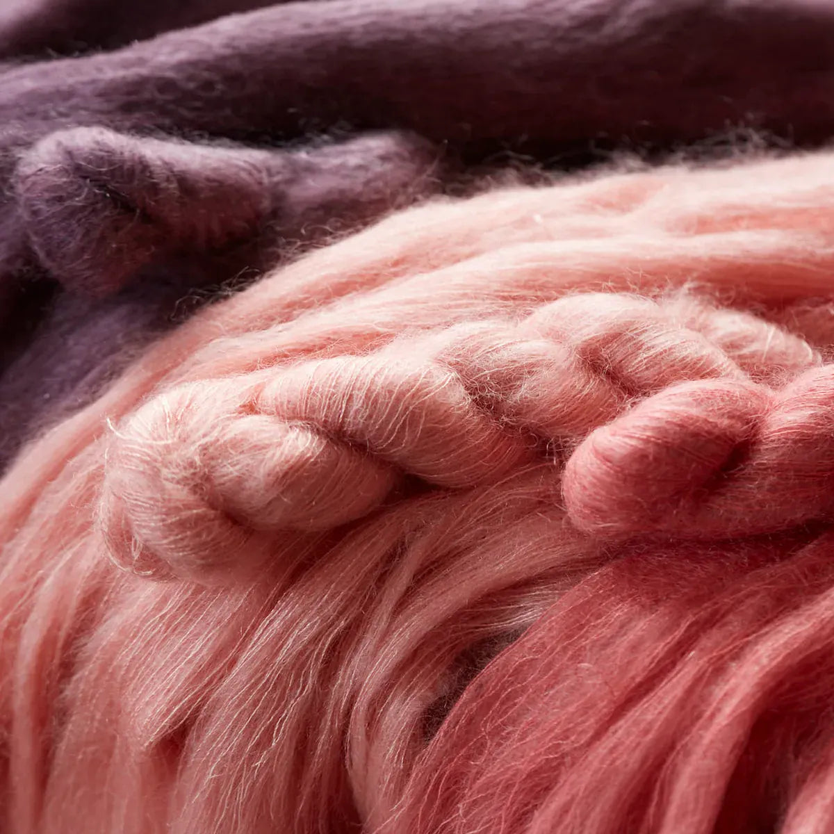 Many skeins of bonmoher laid out to stretch, showing the individual strands and halo