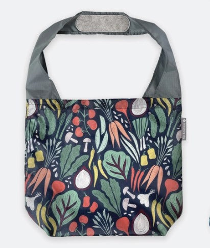 Flip & Tumble tote style bag laid flat with a printed pattern of fruits and vegetables.