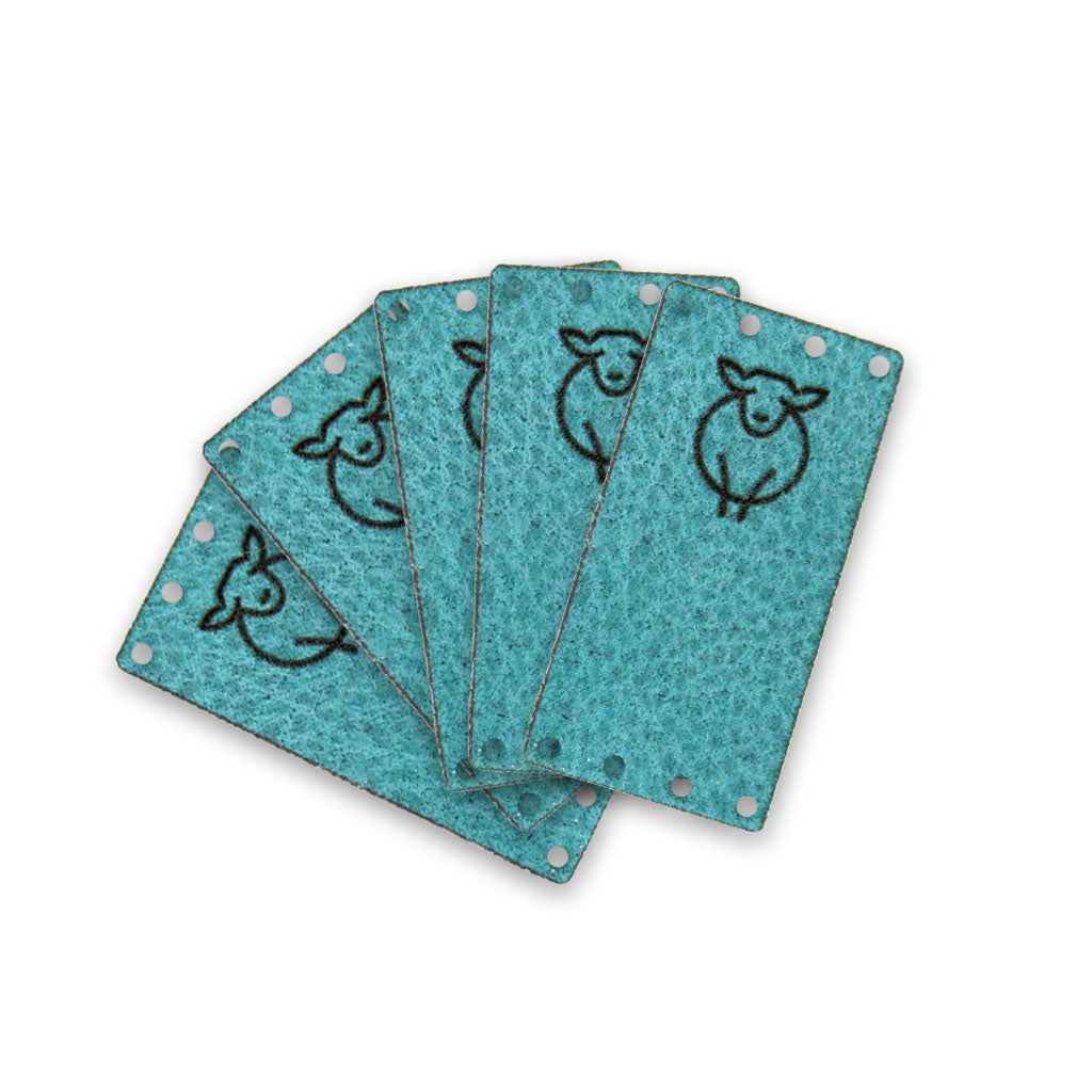 5 pack of Paradise Fibers Sheep Logo Turquoise suede labels.