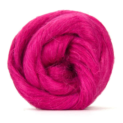 Color Bonbon. A dark pink shade of dyed Flax fiber spinning top.