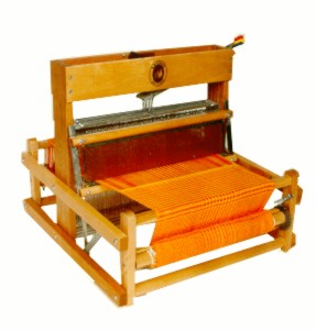 LeClerc Dorothy table loom with orange weaving on the warp