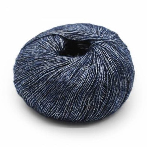 Wound ball of Mirasol Inka yarn in a slightly shiny darky navy-grey color.
