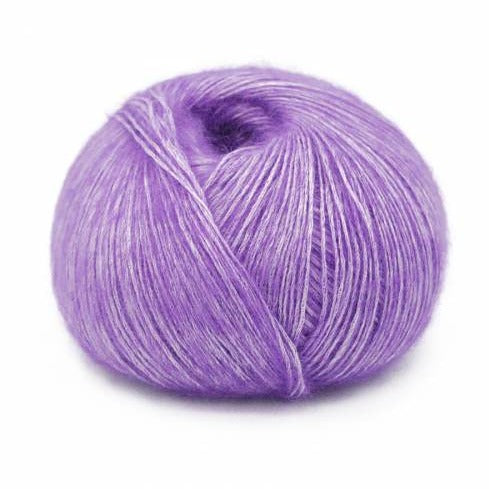 Wound ball of Mirasol Inka yarn in a slightly shiny Amethyst/ purple color.