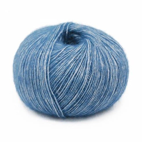 Wound ball of Mirasol Inka yarn in a slightly shiny Aquamarine/light blue color.
