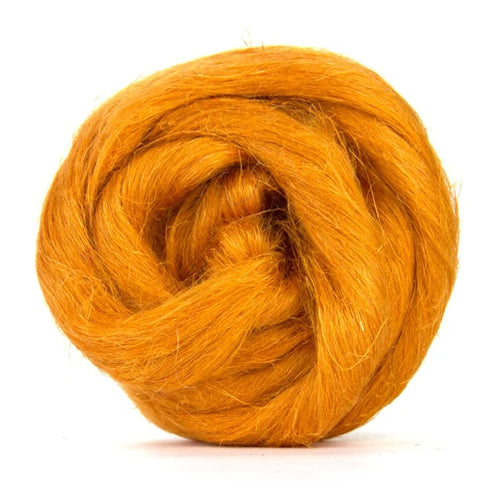 Color Ginger. A medium orange shade of dyed Flax fiber spinning top.