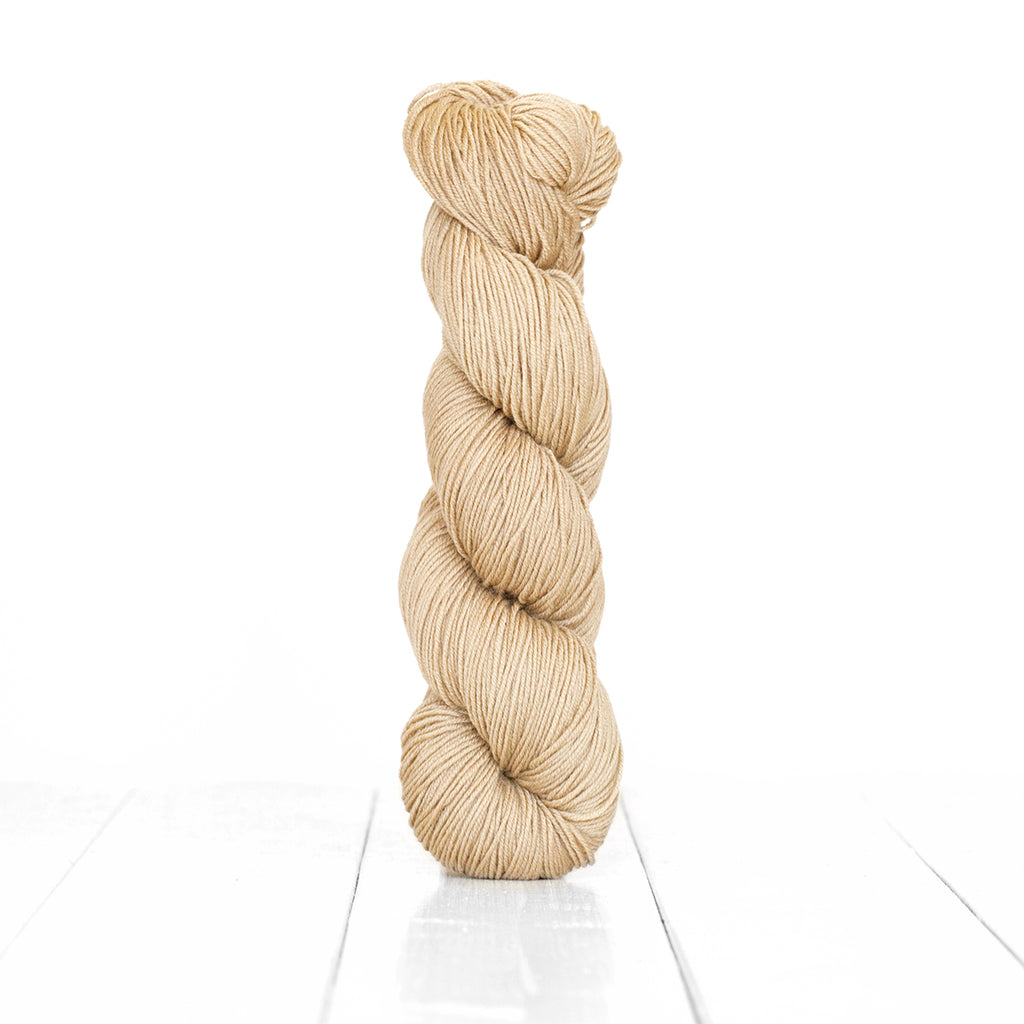 Color Hazelnut, hand-dyed skein of yarn, light tan color produced from natural hazelnuts.
