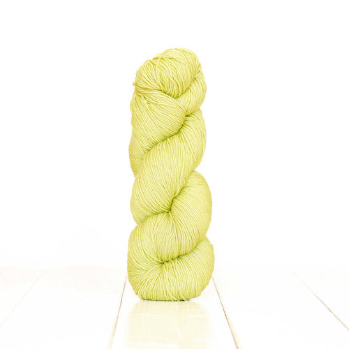 Harvest Fingering dyed light yellow-green with Pistachios.