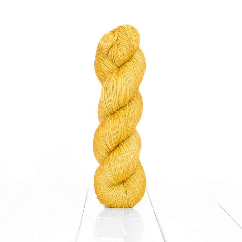 Color Acorn, hand-dyed skein of yarn, light yellow tan color produced from natural acorns.