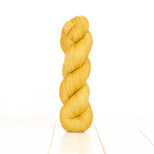Harvest Fingering dyed golden yellow with Pomegranate.