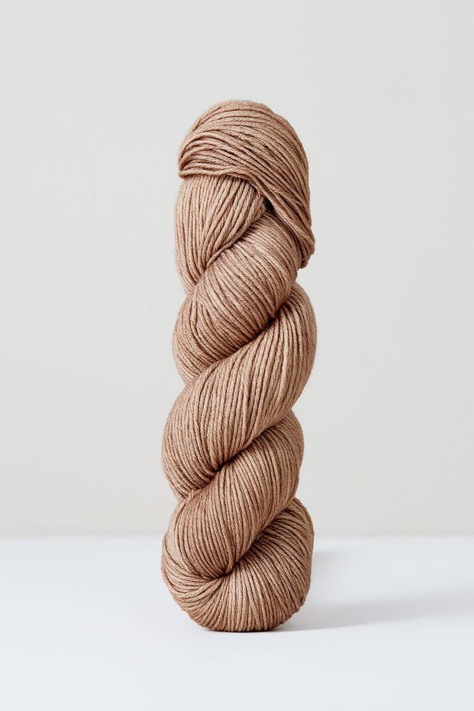 Color Hazelnut, hand-dyed skein of yarn, in beige-ish tan color naturally dyed with grape hazelnuts.