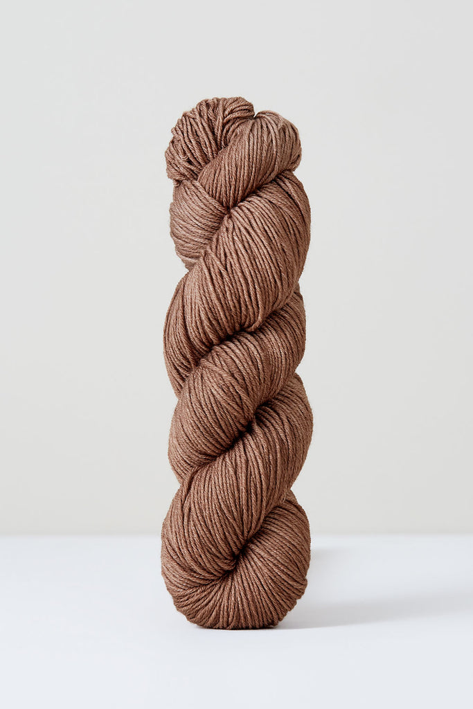 Color Walnut, hand-dyed skein of yarn, in a light brown naturally dyed with walnuts.