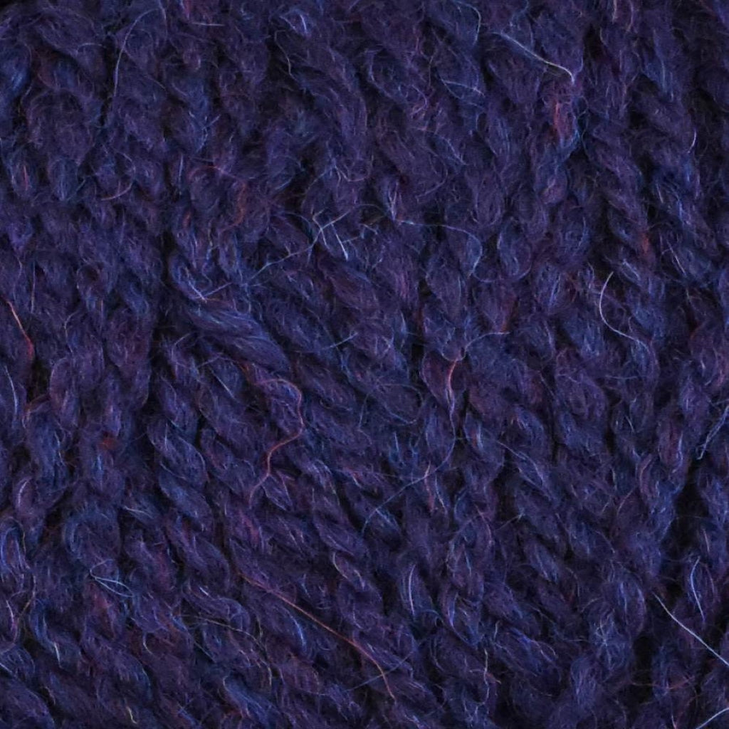 Color: Night 018. A dark purple, heathered variant of Jody Long Andeamo Lite Yarn