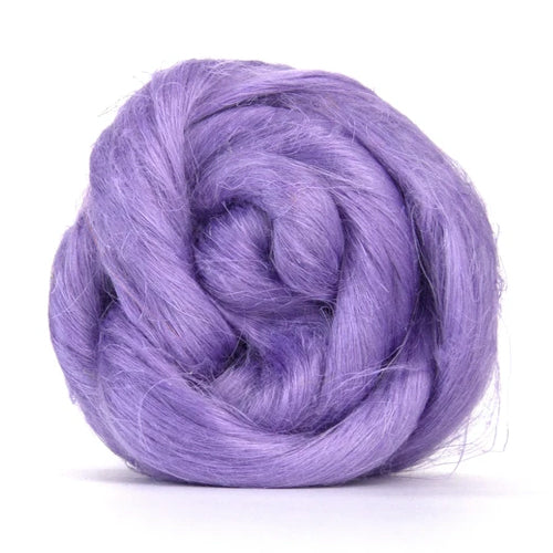 Color Lilac. A soft purple shade of dyed Flax fiber spinning top.