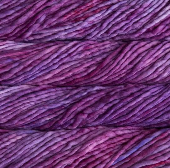 Color: Baya Electrica 865. A purplish pink variegated variant of Malabrigo Rasta yarn. 