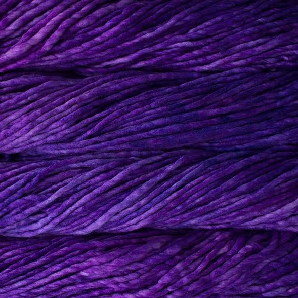Color: Jacinto 193. A bright, florescent purple variegated variant of Malabrigo Rasta yarn. 