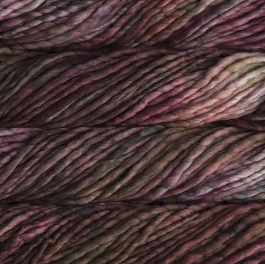Color: Oxido 860. A rust red and brown variegated variant of Malabrigo Rasta yarn. 