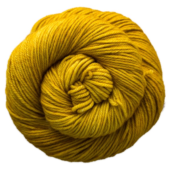 A skein of Caprino in the color Frank Ochre 035, a tonal yellow colorway.