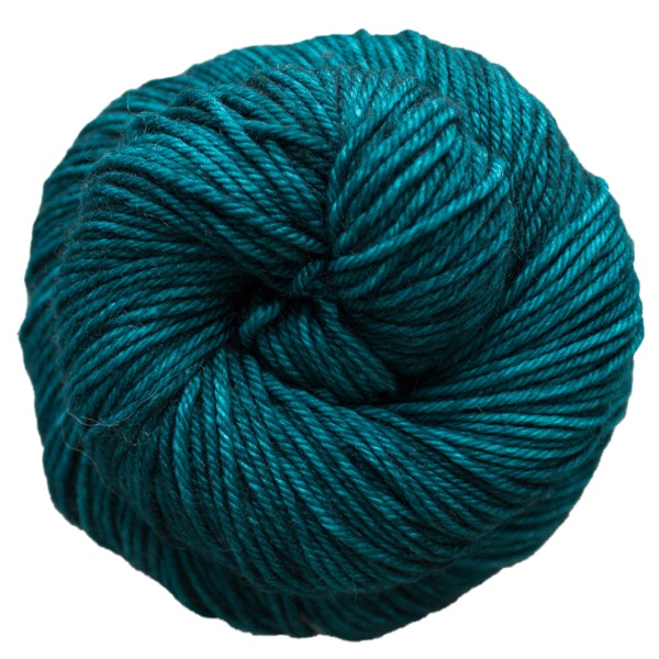 A skein of Caprino in the color Teal Feather 412, a bright teal blue colorway.