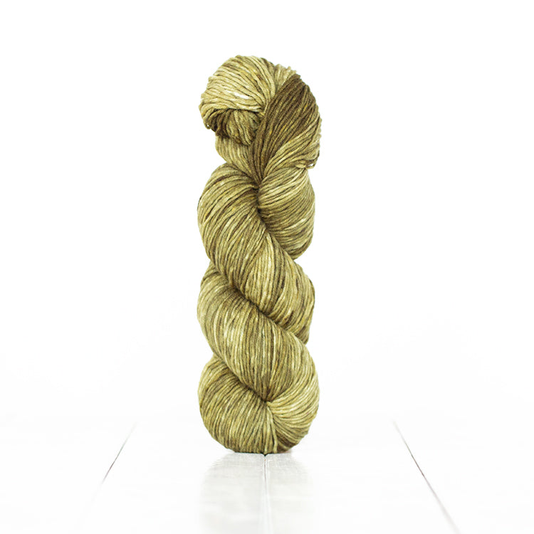 Color 6059, a variegated monochromatic skein of army green yarn.