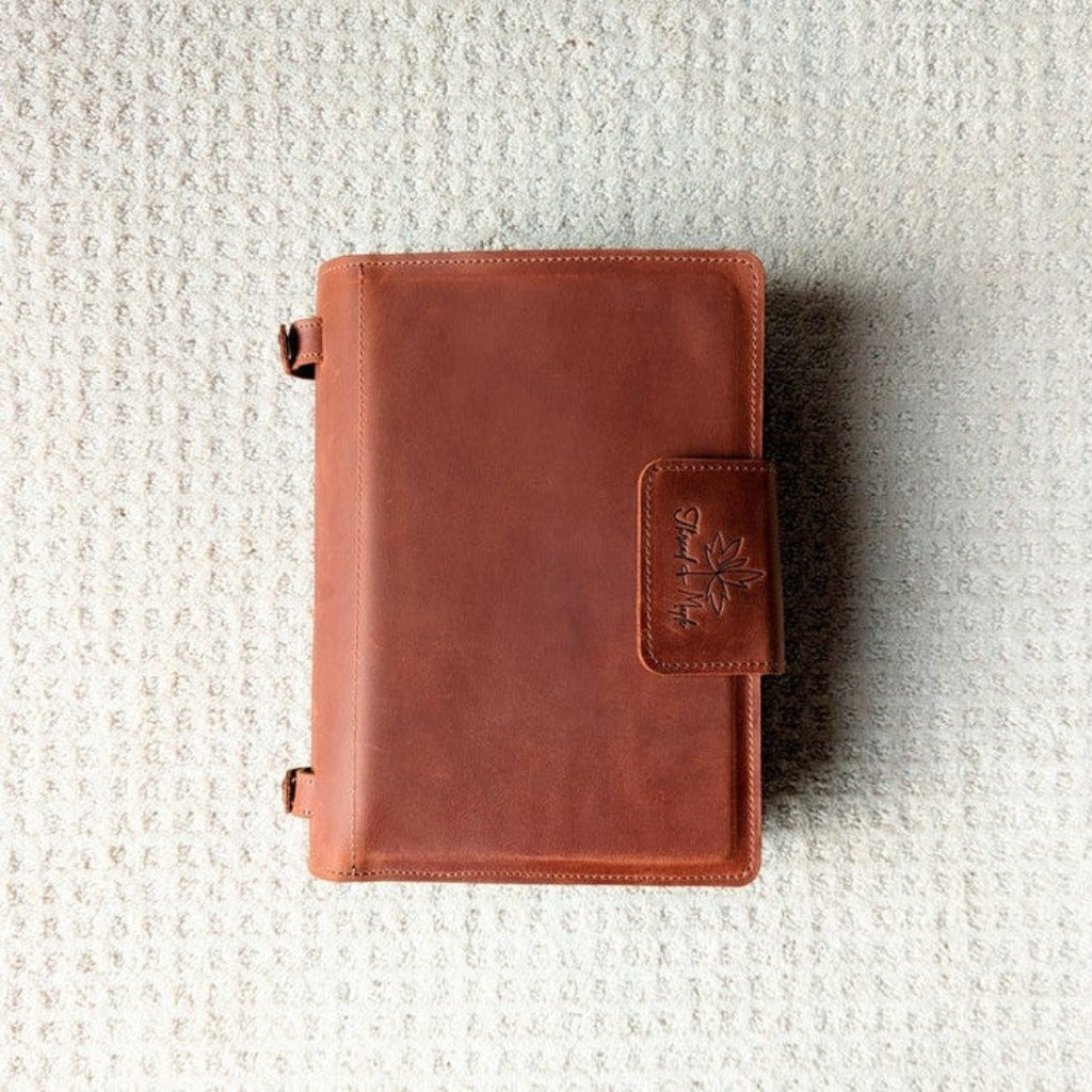 Color: Whiskey. Front of Thread and Maple Leather Knitting Needle binder with a golden brown color.