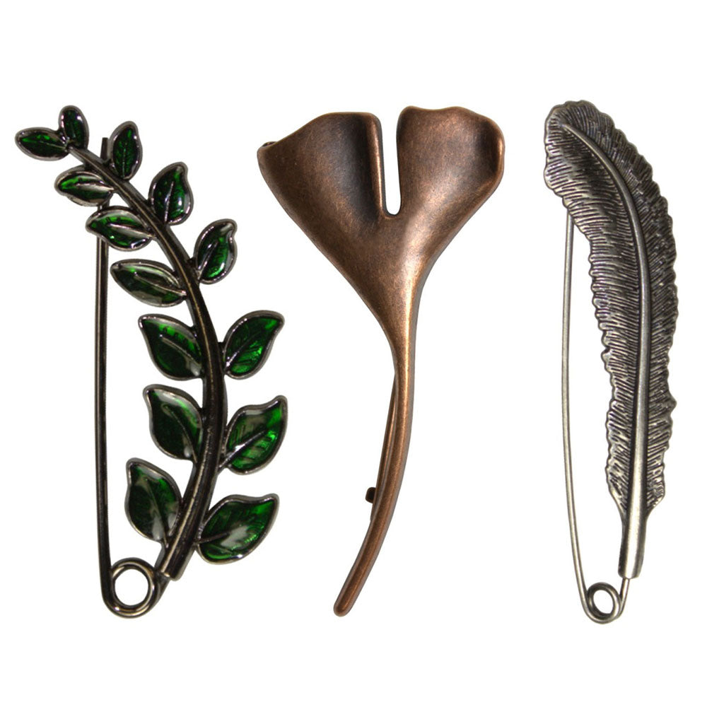 3 of HiyaHiya's shawl pins in the styles Fern, Copper Ginko, and Antique Feather.