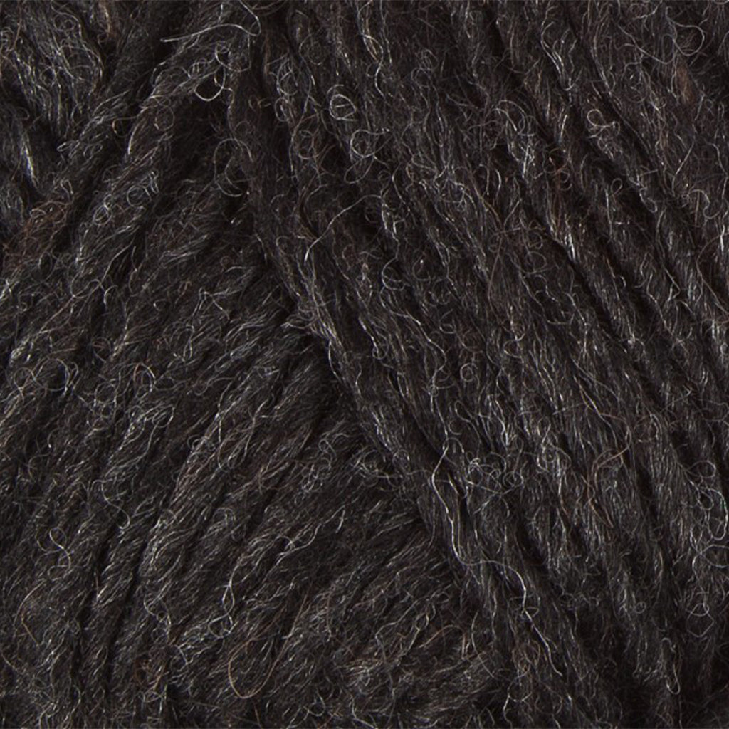 Black Heather 0005, a heathered black skein of Lopi's Álafosslopi, a bulky Icelandic wool yarn.