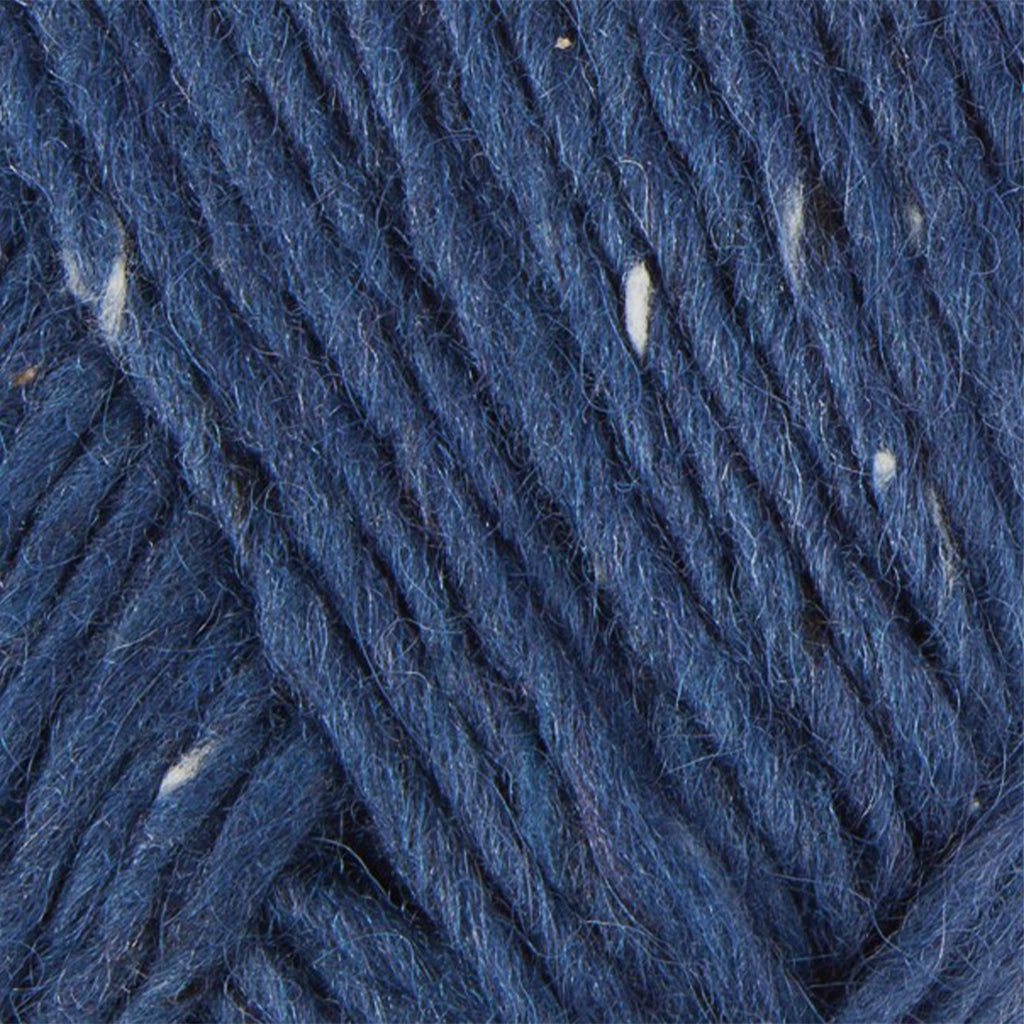 Blue Tweed 1234, a navy blue with white flecks skein of Lopi's Álafosslopi, a bulky wool yarn.