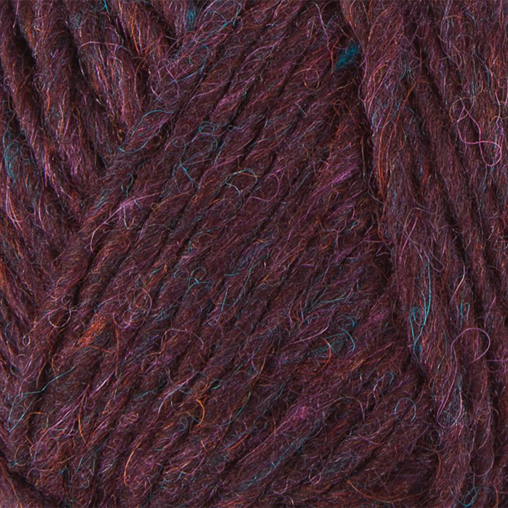 Bordeaux 9961, a heathered rich plum skein of Lopi's Álafosslopi, a bulky Icelandic wool yarn.