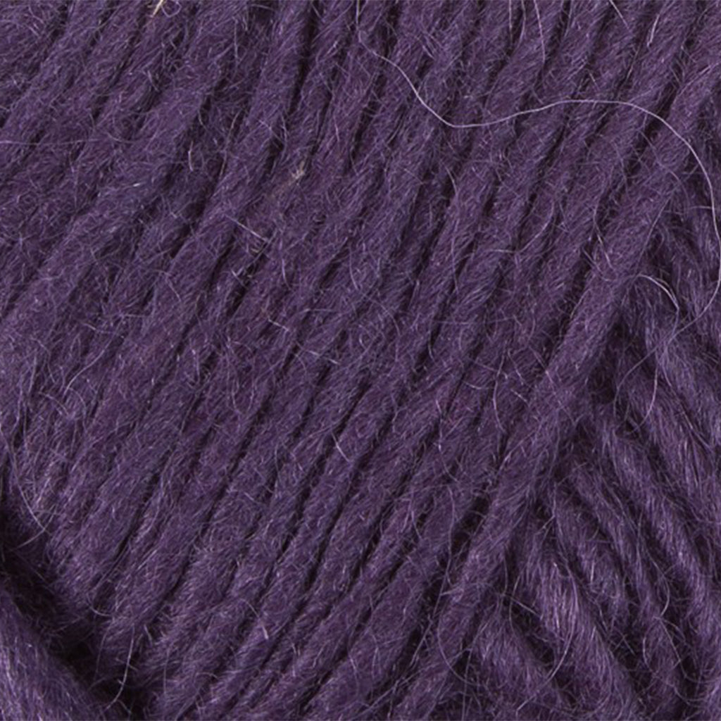 Dark Soft Purple 0163, a dark violet skein of Lopi's Álafosslopi, a bulky Icelandic wool yarn.