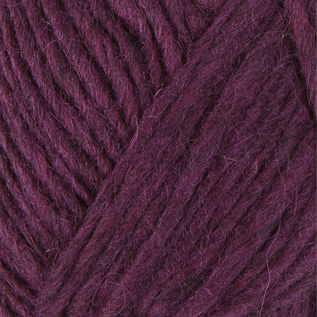 Gloxinia 1241, a warm purple skein of Lopi's Álafosslopi, a bulky Icelandic wool yarn.