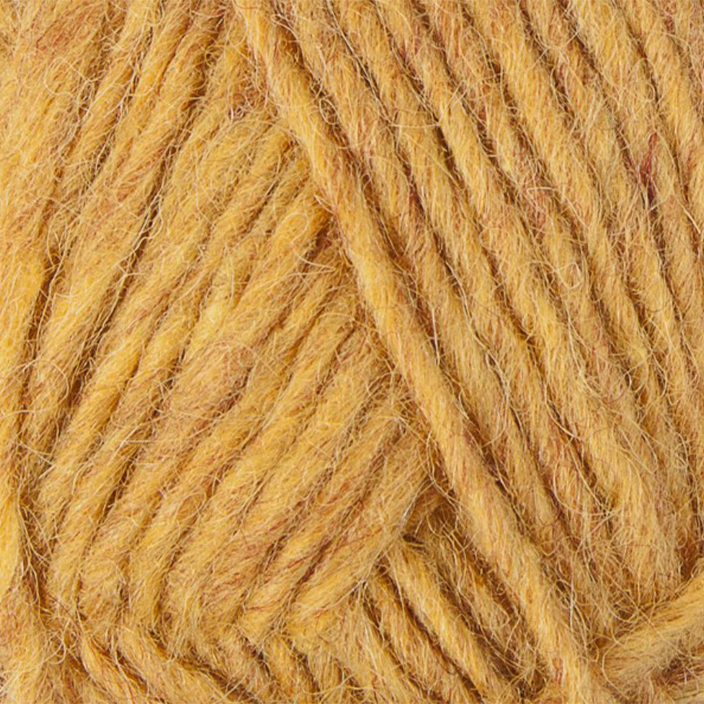 Golden 9964, a golden yellow skein of Lopi's Álafosslopi, a bulky Icelandic wool yarn.