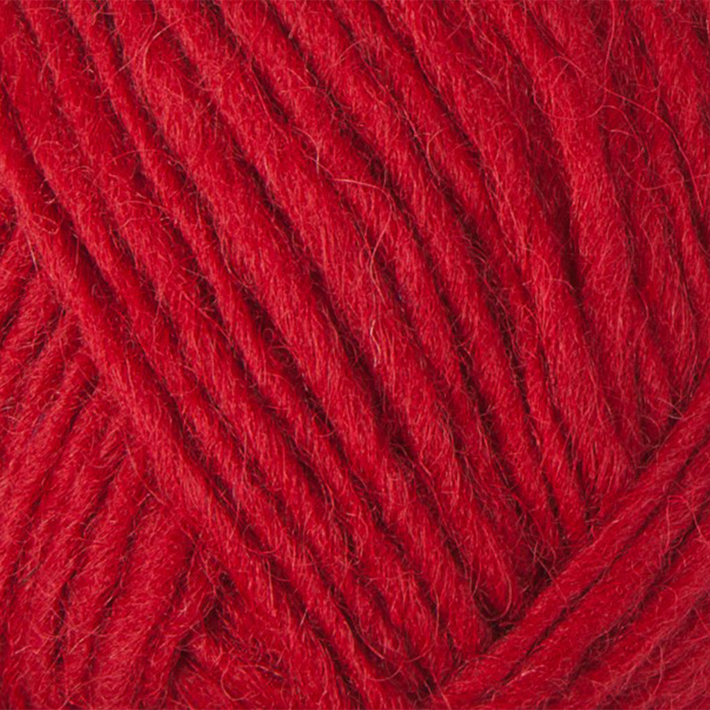 Happy Red 0047, a vibrant red skein of Lopi's Álafosslopi, a bulky Icelandic wool yarn.
