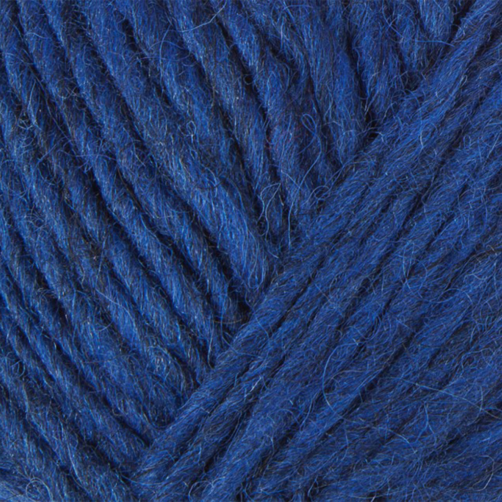 Space Blue 1233, a vibrant blue skein of Lopi's Álafosslopi, a bulky Icelandic wool yarn.