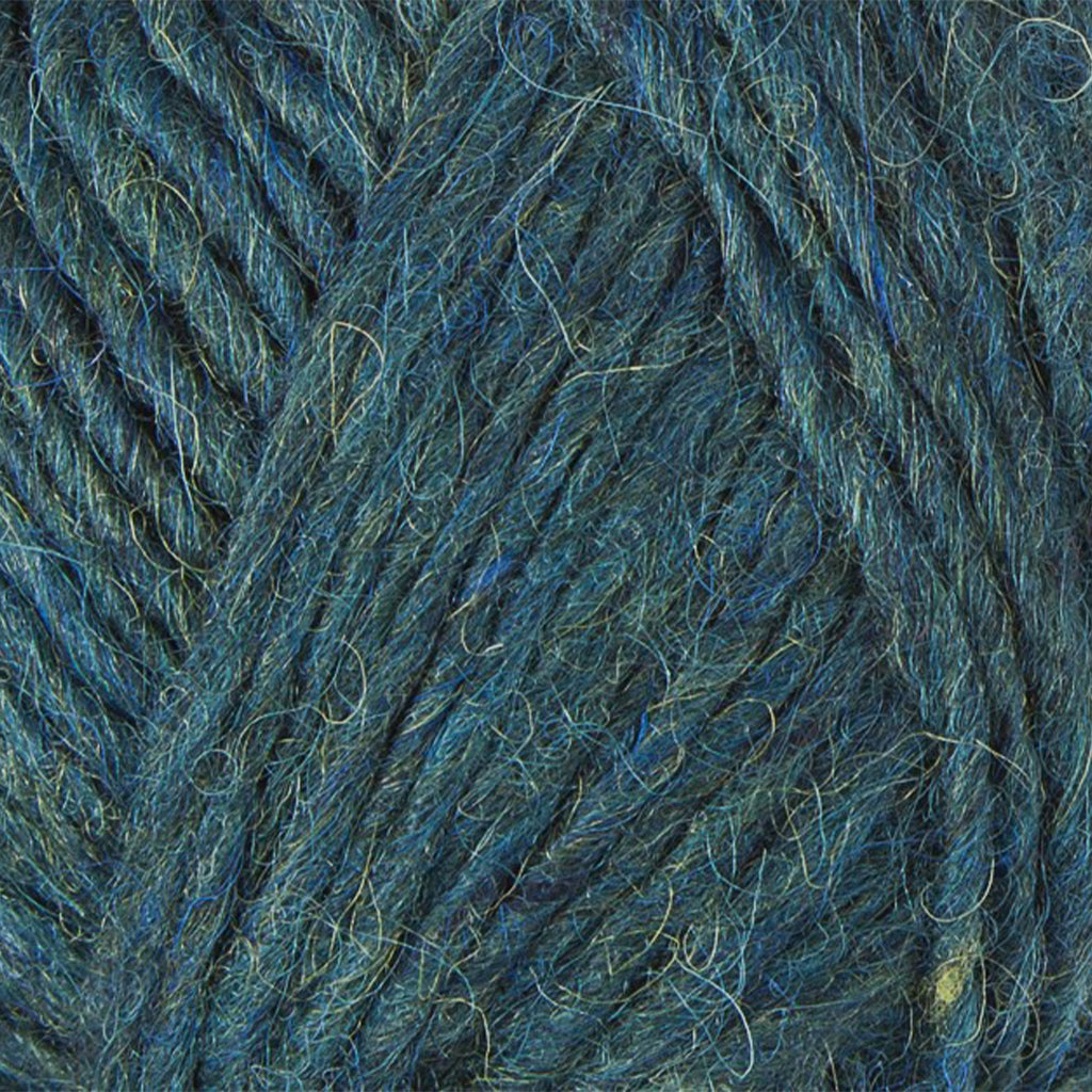 Teal 9967, a rich heathered teal blue skein of Lopi's Álafosslopi, a bulky Icelandic wool yarn.