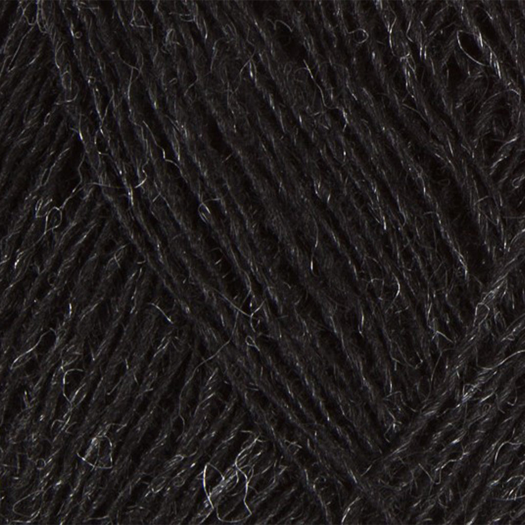 Black Heather 0151, a natural heathered black skein of Lopi's Einband Icelandic wool lace yarn.