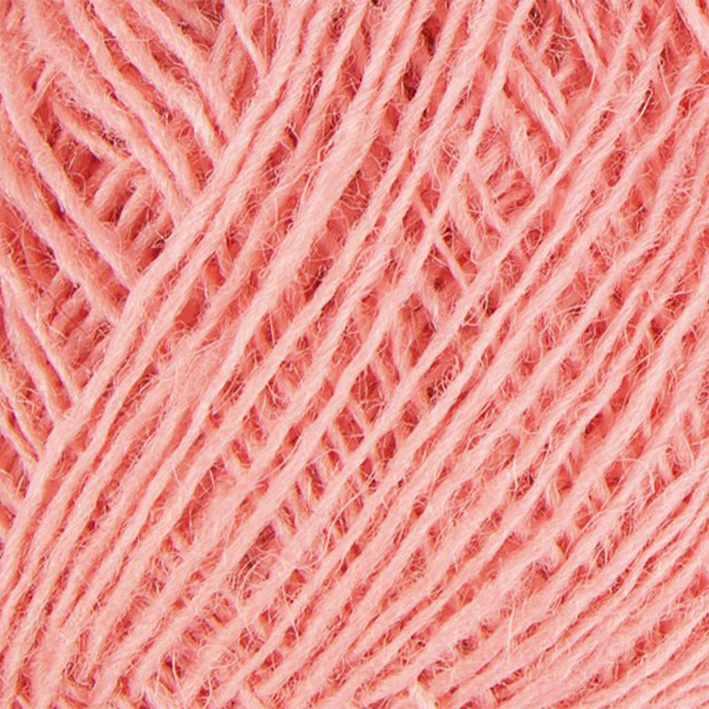 Blush 9128, a pastel candy pink skein of Lopi's Einband Icelandic wool lace yarn.