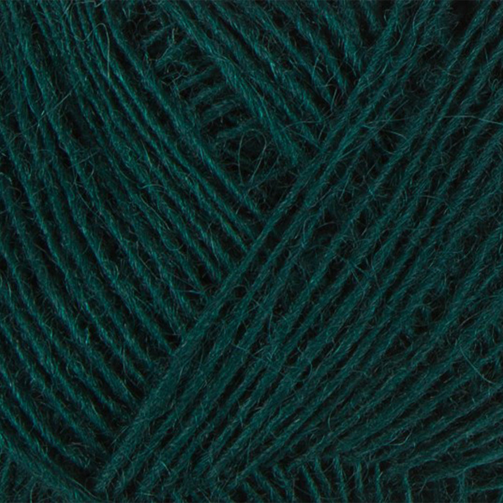 Dark Green 9112, a dark emerald green skein of Lopi's Einband Icelandic wool lace yarn.