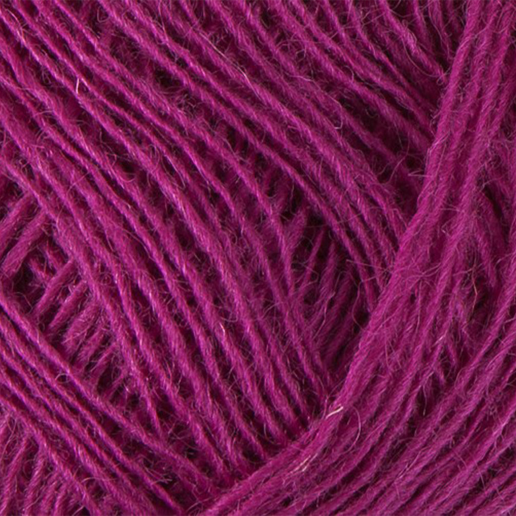Fuchsia 9142, a purplish pink skein of Lopi's Einband Icelandic wool lace yarn.