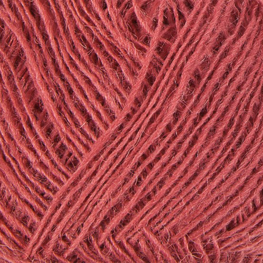 Grenadine 9171, a dusty reddish pink skein of Lopi's Einband Icelandic wool lace yarn.