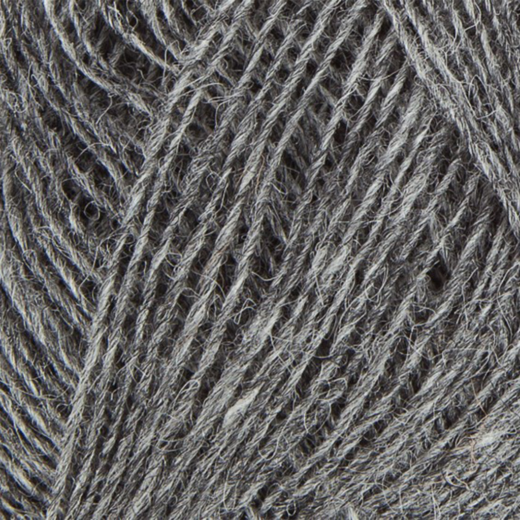 Grey 9102, a medium heathered grey skein of Lopi's Einband Icelandic wool lace yarn.