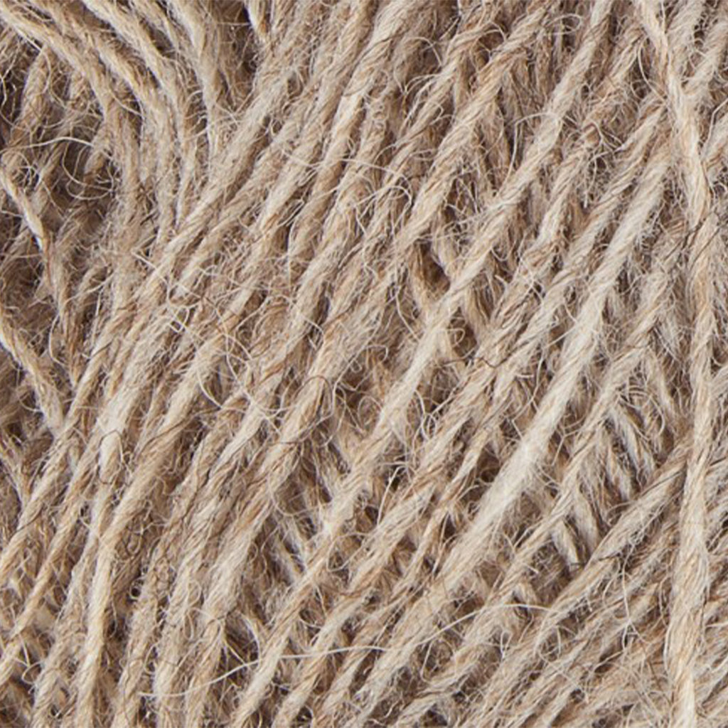 Light Beige 0886, a light heathered beige skein of Lopi's Einband Icelandic wool lace yarn.