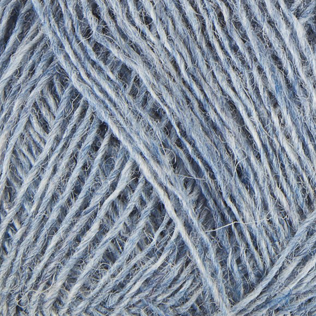 Light Denim 0008, a light heathered blue skein of Lopi's Einband Icelandic wool lace yarn.