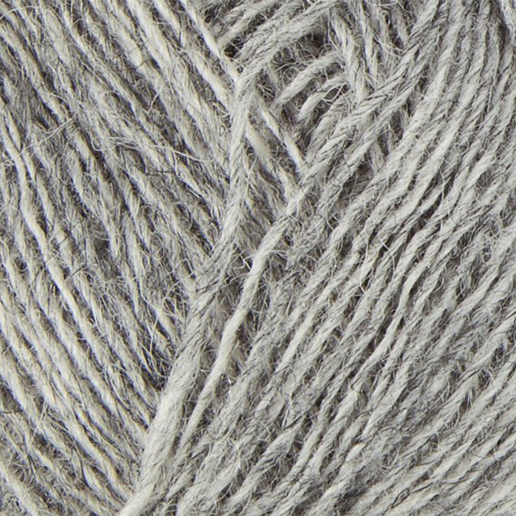Light Grey 1027, a light heathered grey skein of Lopi's Einband Icelandic wool lace yarn.