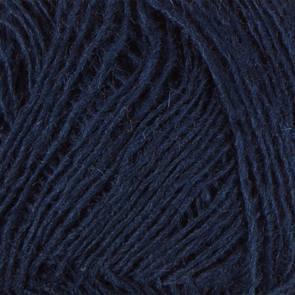 Navy 0118, a dark blue skein of Lopi's Einband Icelandic wool lace yarn.
