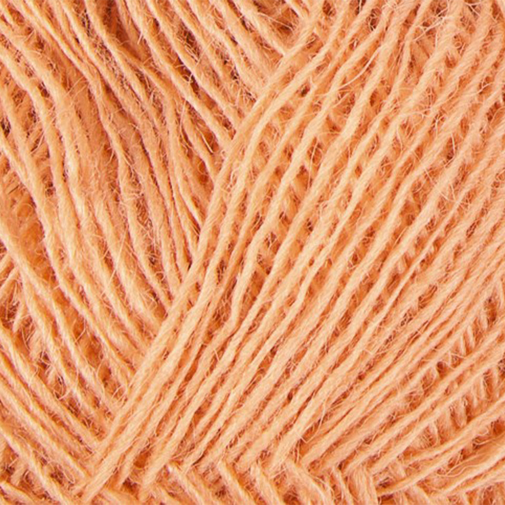 Peach 9990, a light orangish pink skein of Lopi's Einband Icelandic wool lace yarn.